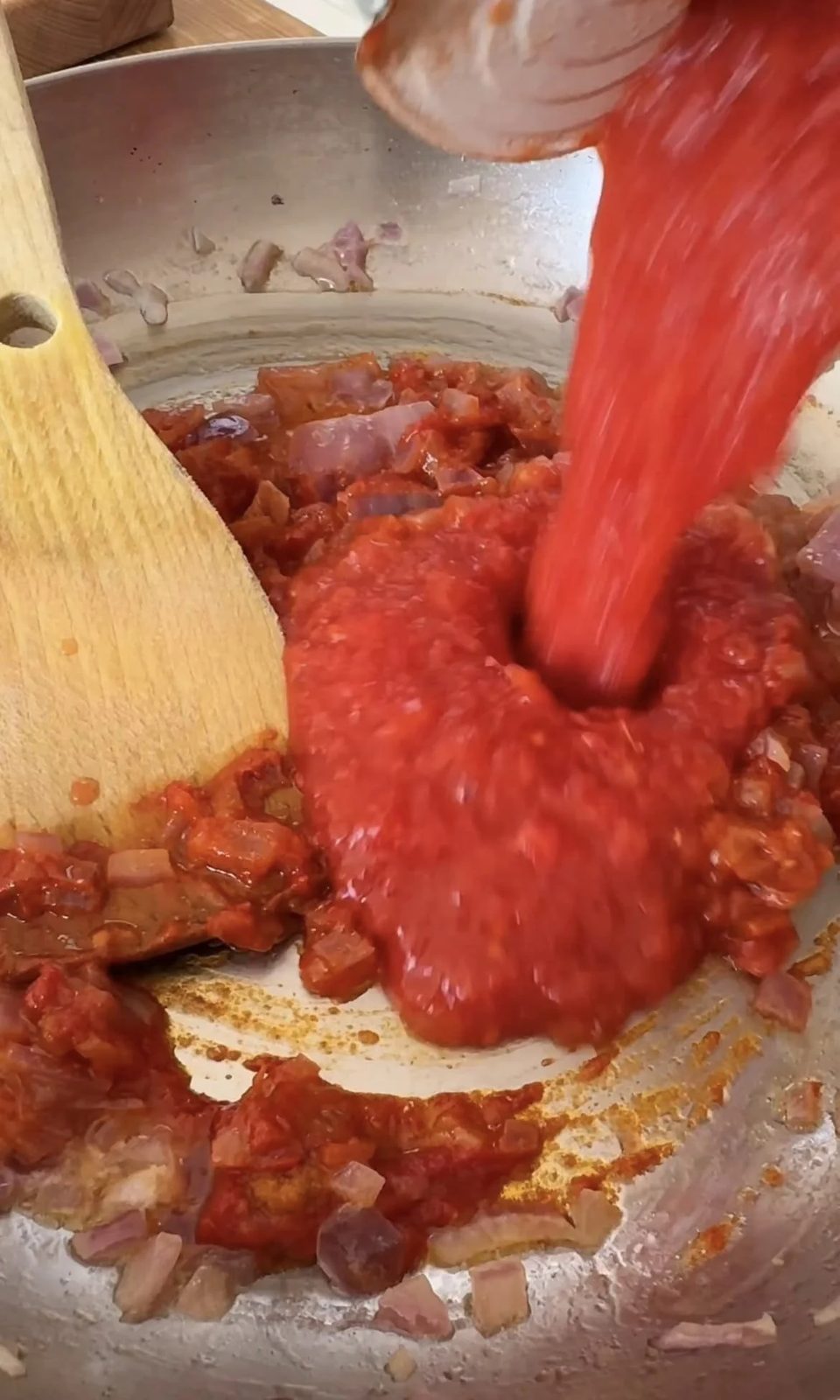 add tinned tomatoes to the sauce.