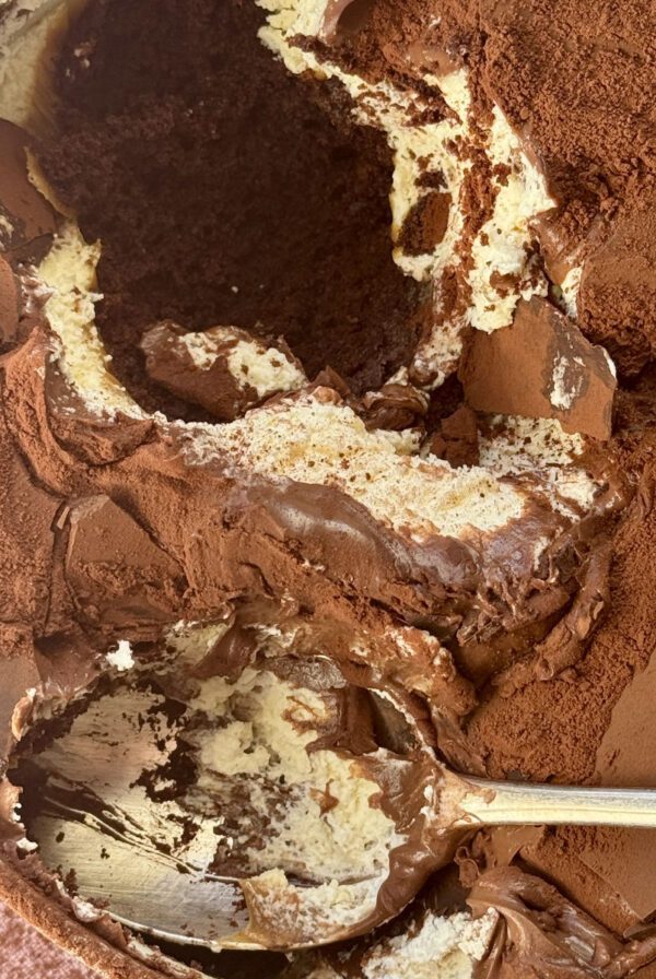 chocolate dream cake in a tin with a spoon.