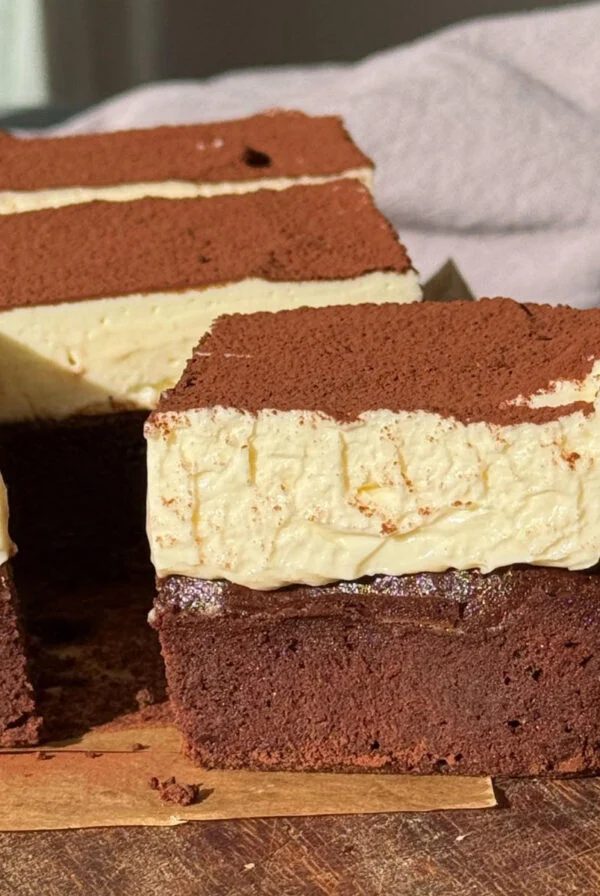 one cheesecake brownie sliced.