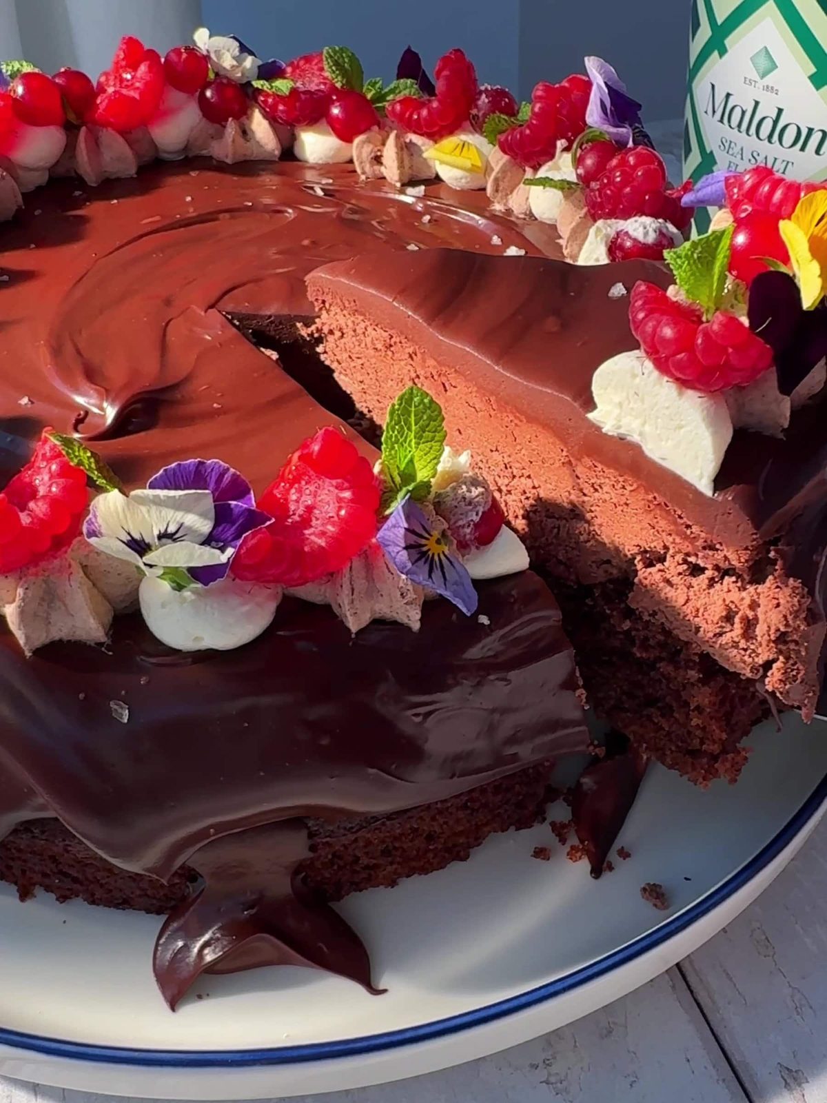 Slicing a piece of the Chocolate Cake with a knife.