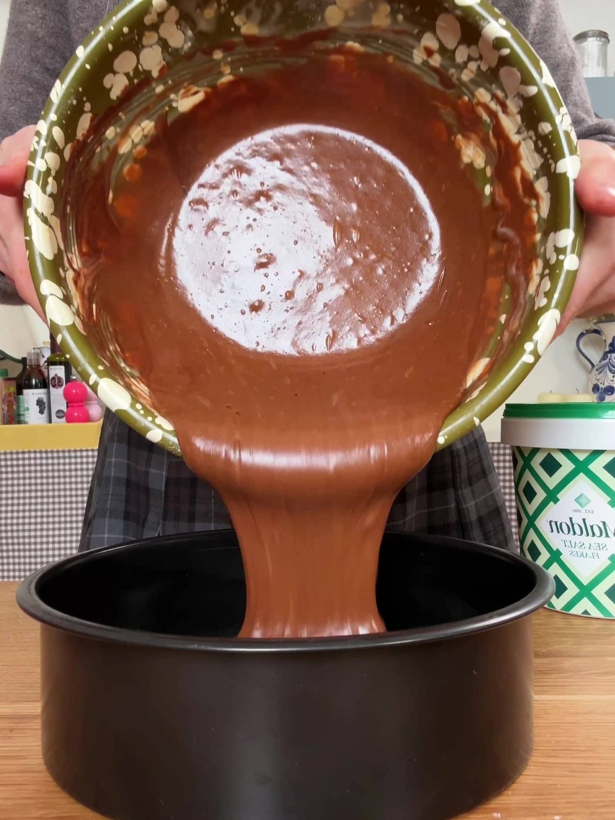 Adding batter to baking tin.