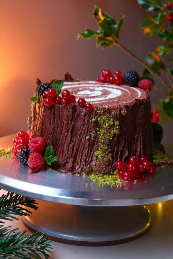 buche de noel on a cake stand.