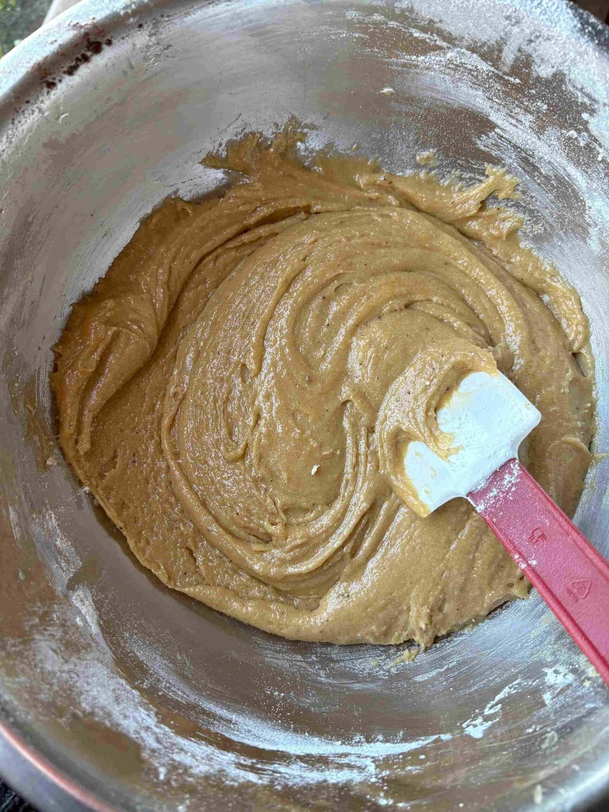Mixing flour into cookie bar dough.