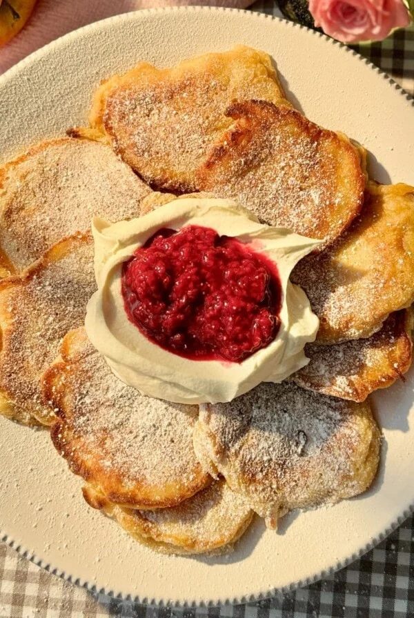 racuchy with cream and raspberry compote.