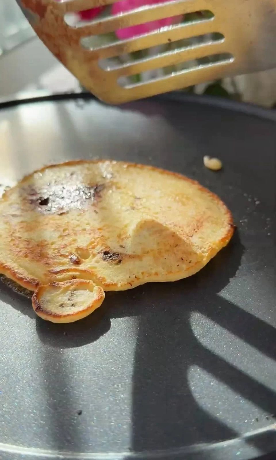 frying chocolate chip pancakes.