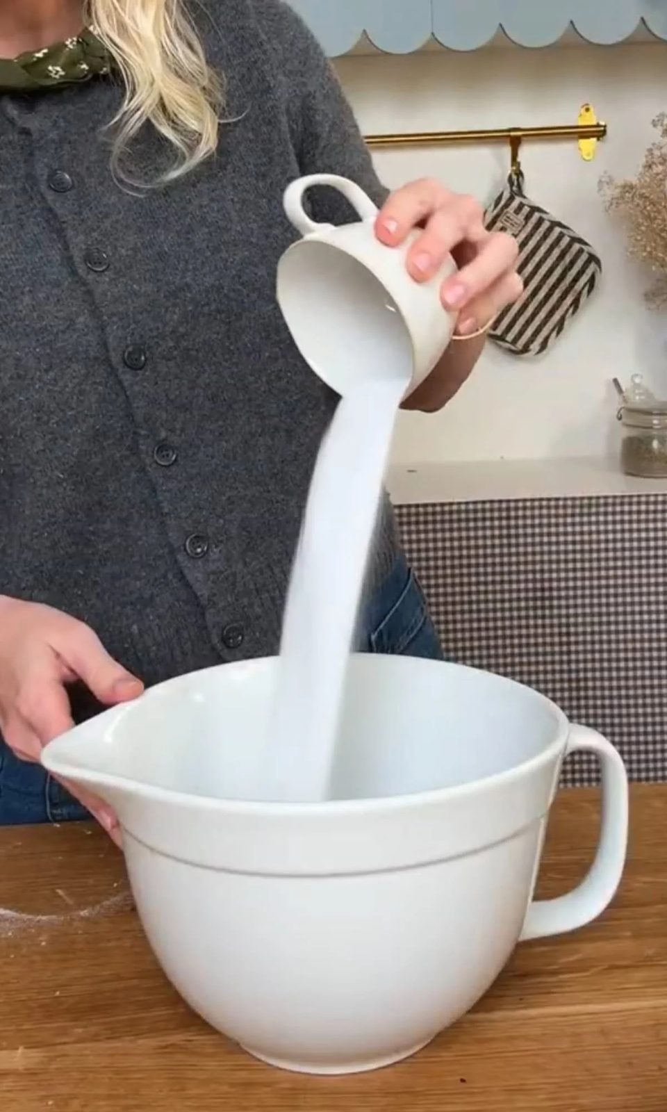 Pouring sugar into bowl for cookie dough.
