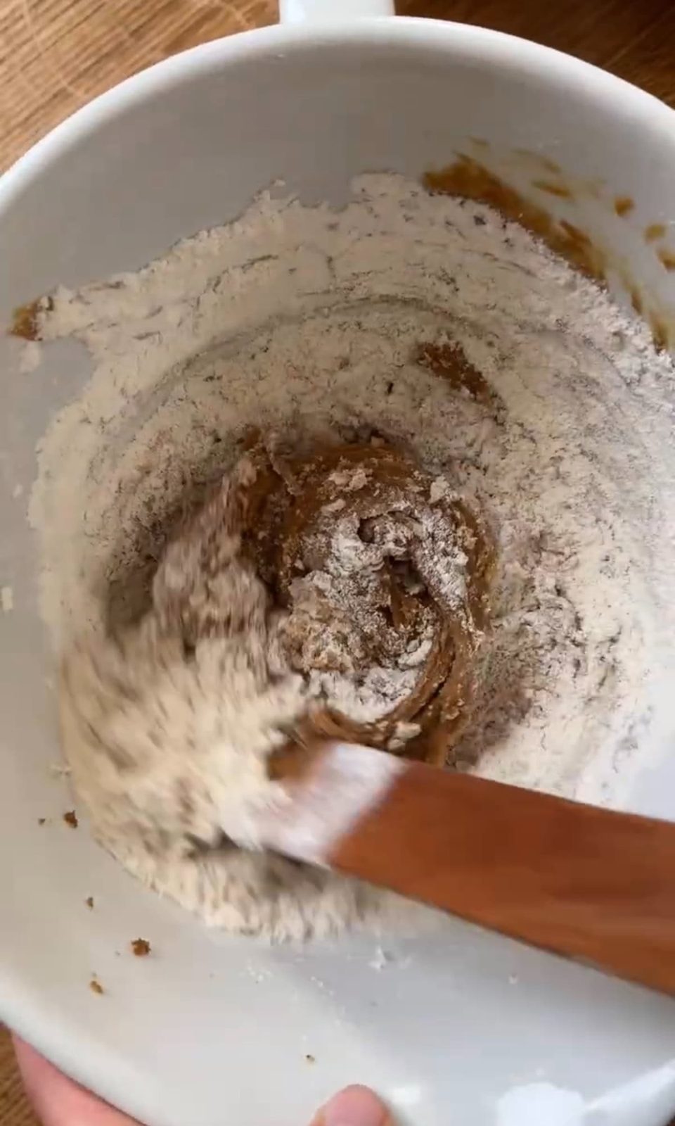Mixing flour into cookie dough.