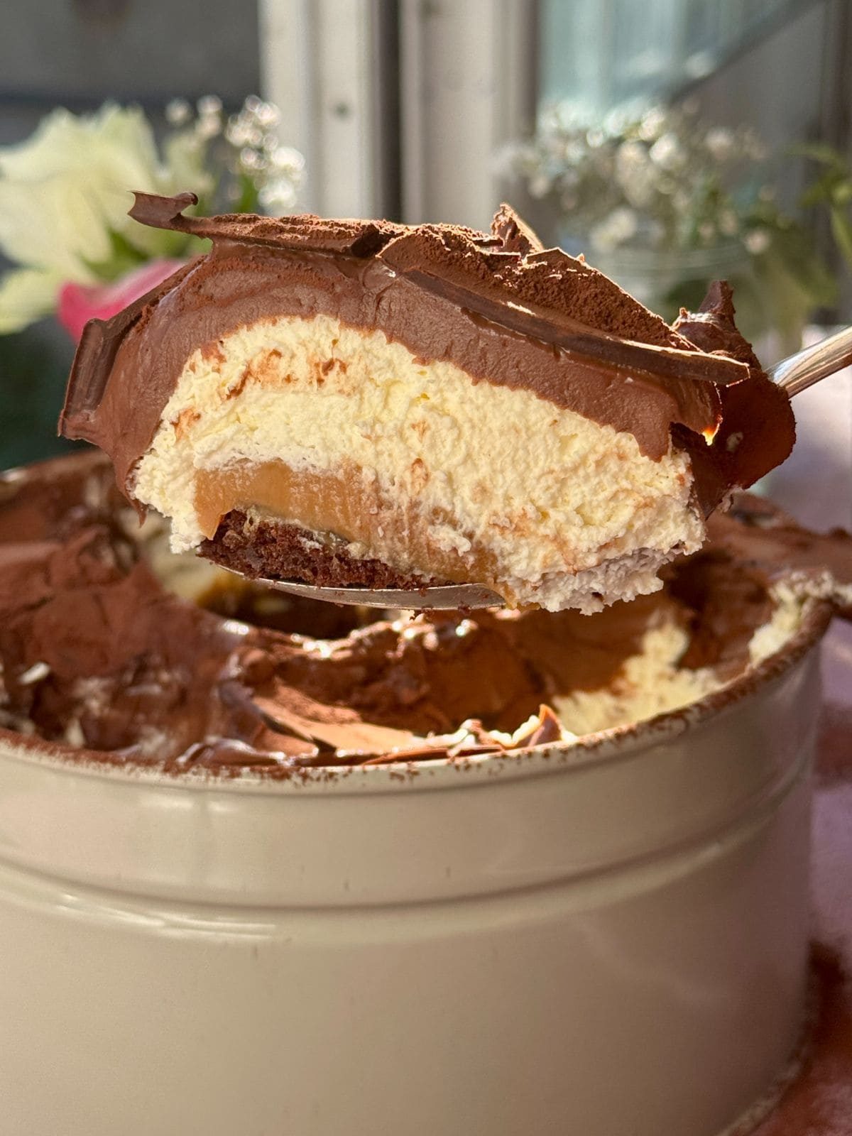Scooping out a portion of chocolate dream cake.