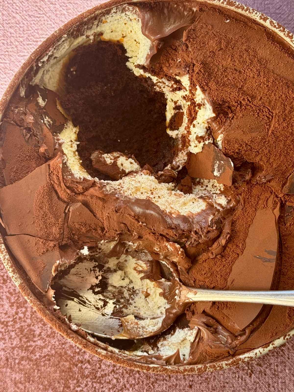 Chocolate dream cake in a tin with a spoon.