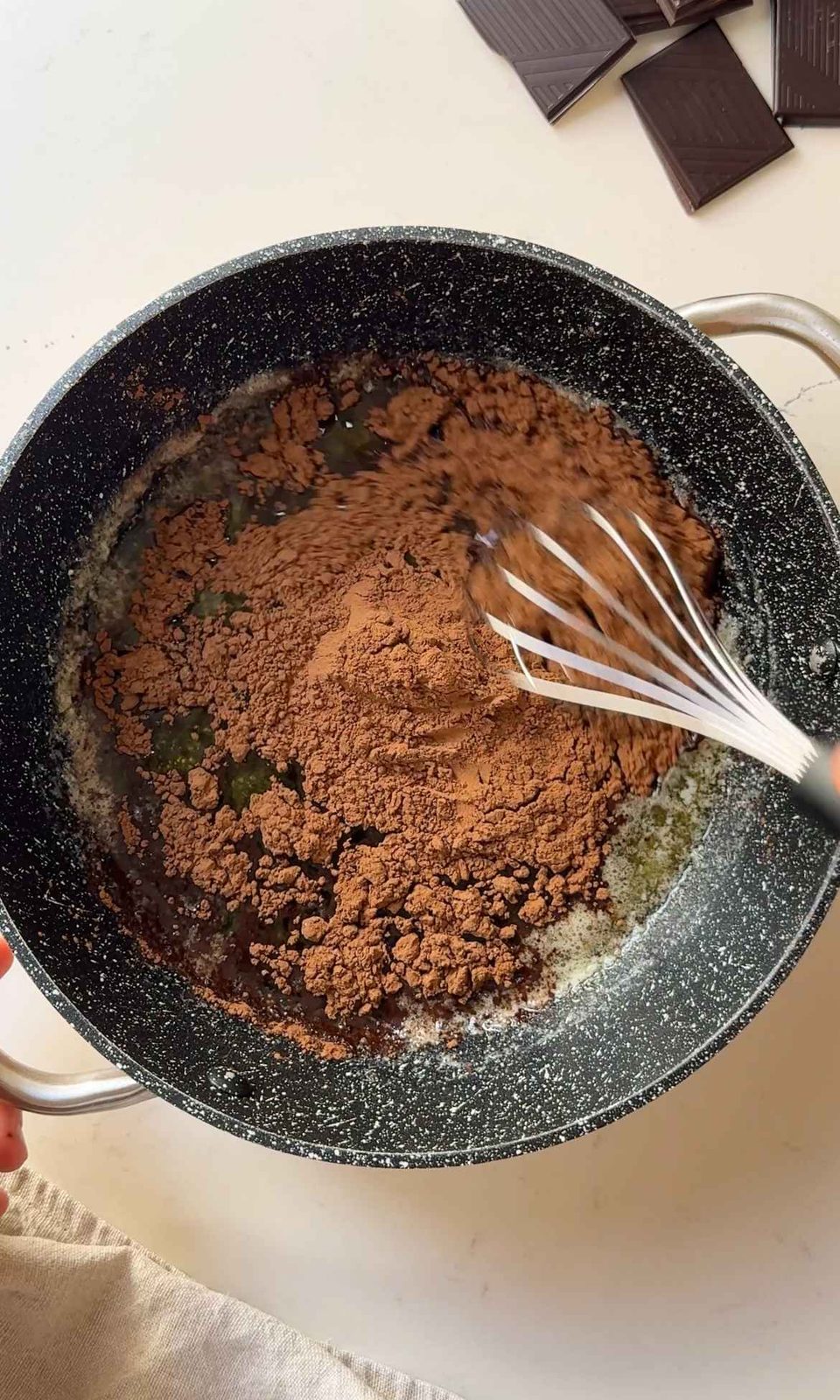 melting cocoa powder into butter.