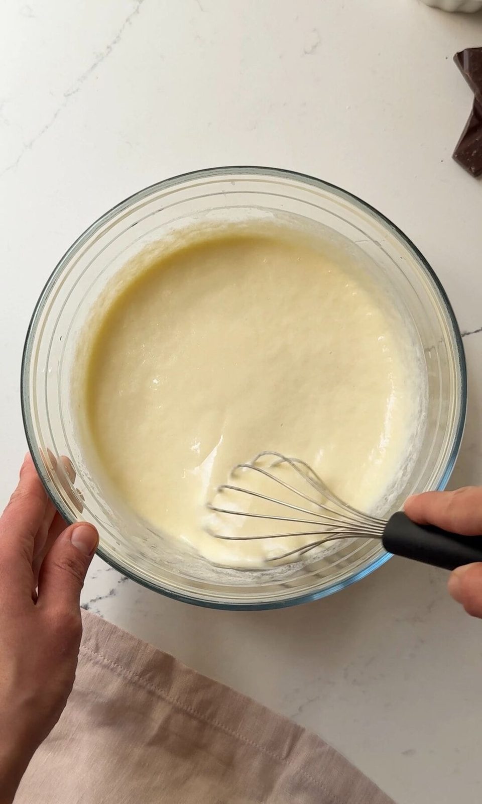 whisking eggs, yoghurt and oil.