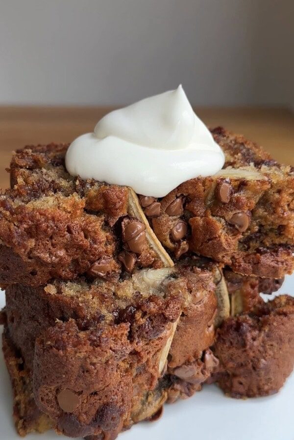 a spoon of yoghurt on slices of chocolate chip banana bread