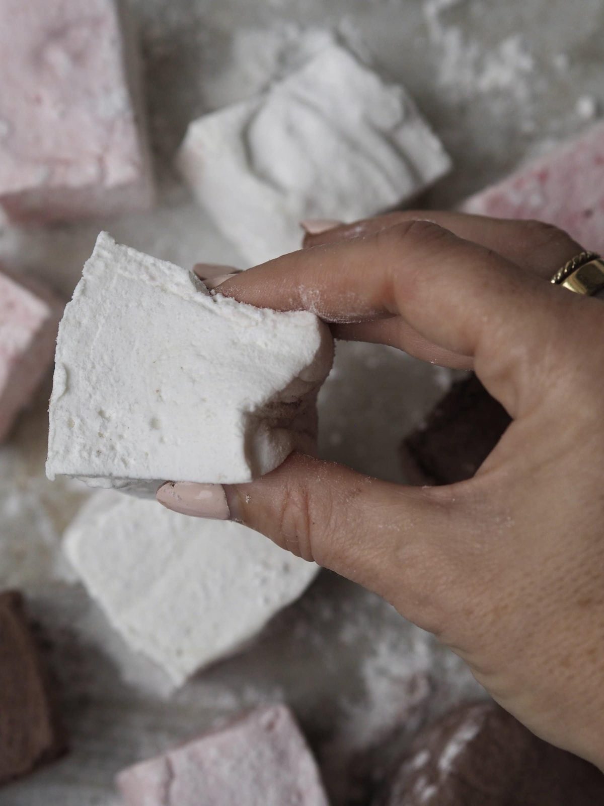 Squeezing a single marshmellow.