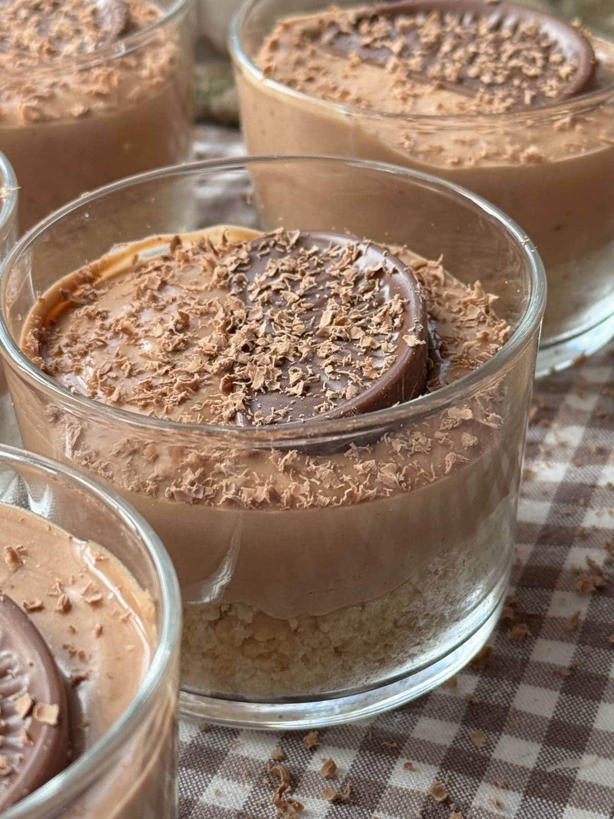 chocolate orange cheesecakes in small glass.