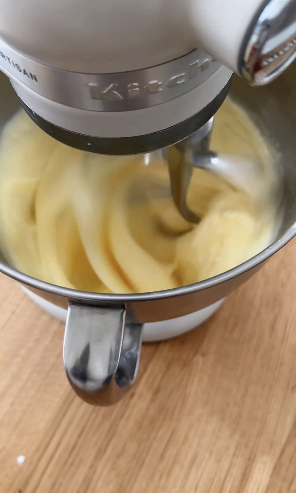 beating eggs and sugar.