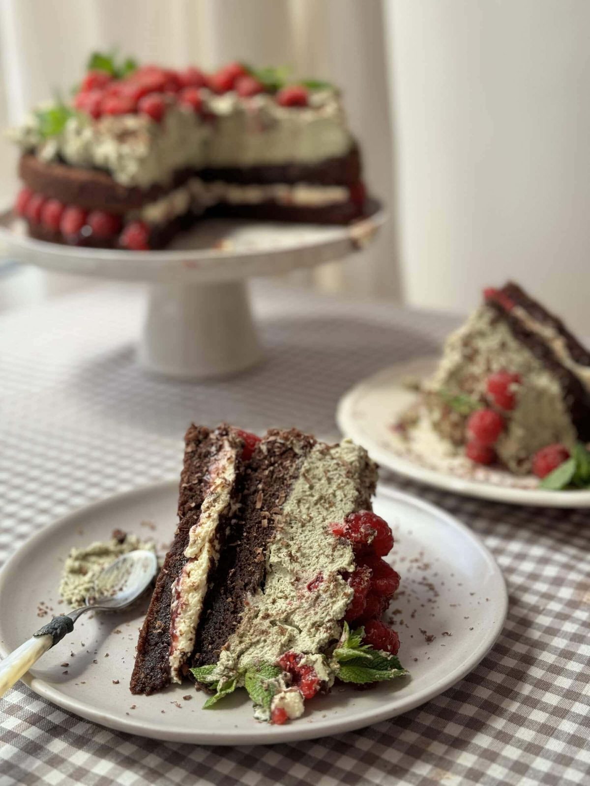 slice of chocolate raspberry cake on plate.