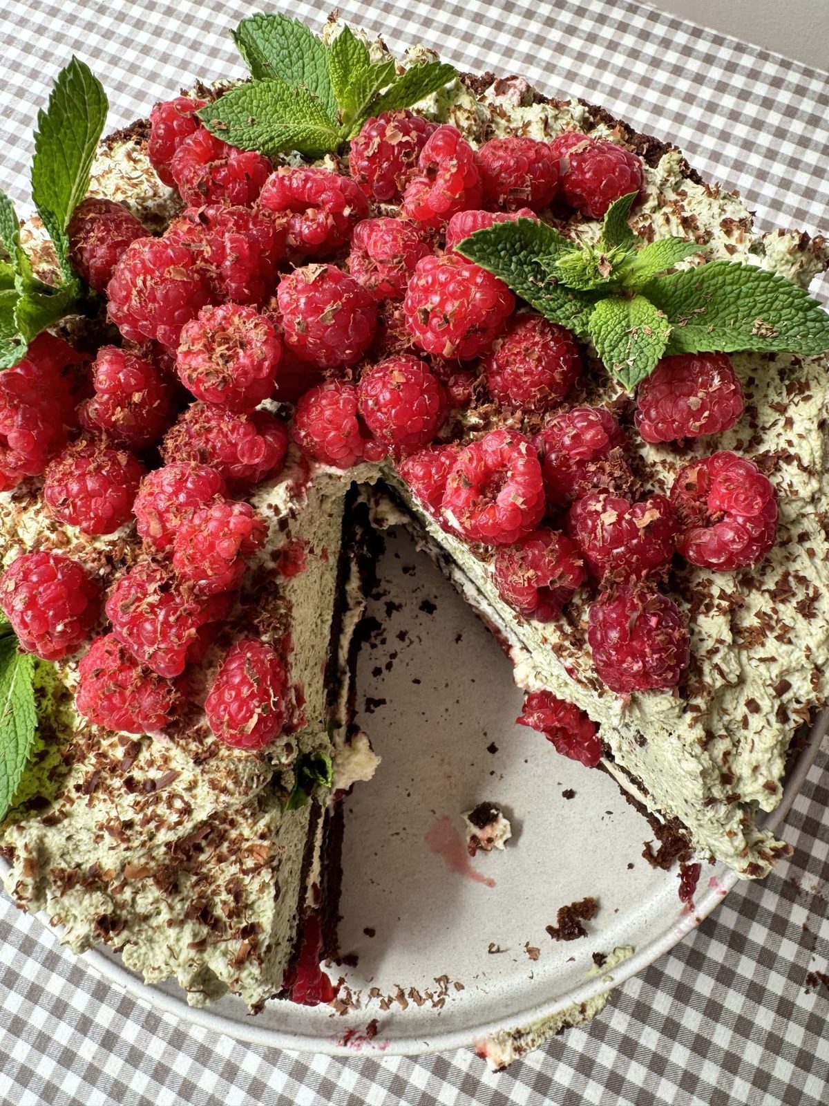 top down view of chocolate raspberry cake with slice out.