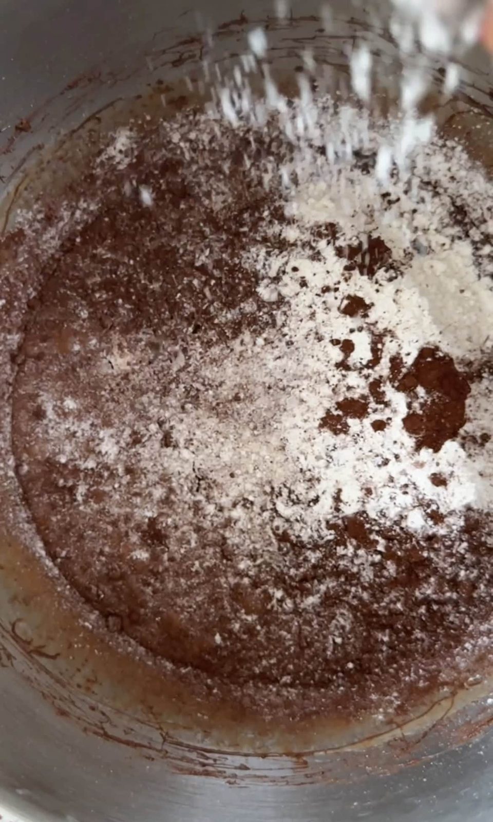 sifting flour into the batter.