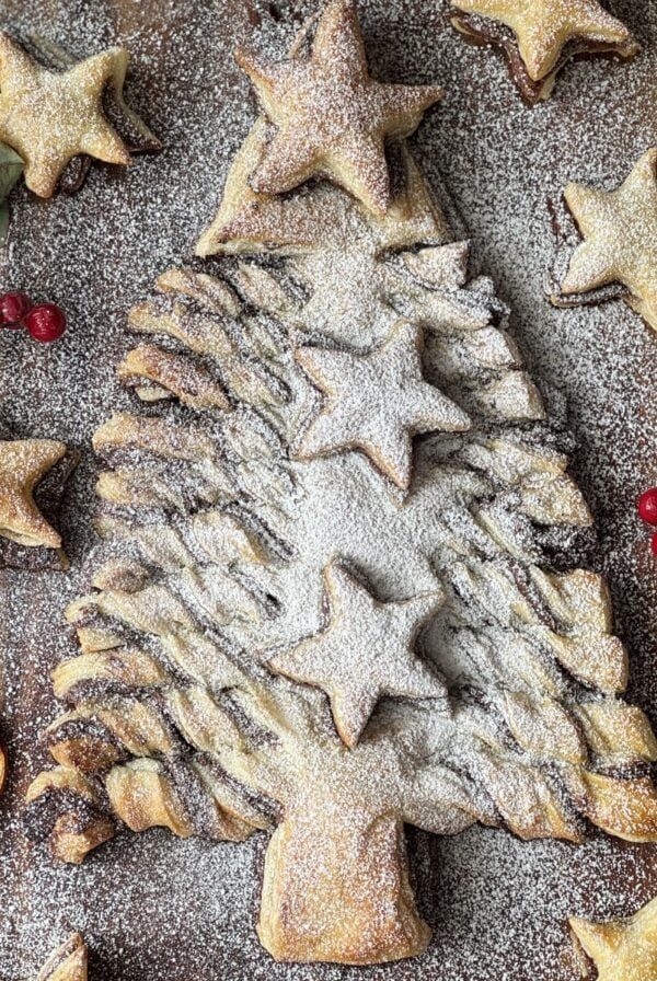 nutella puff pastry christmas tree on a wooden board.