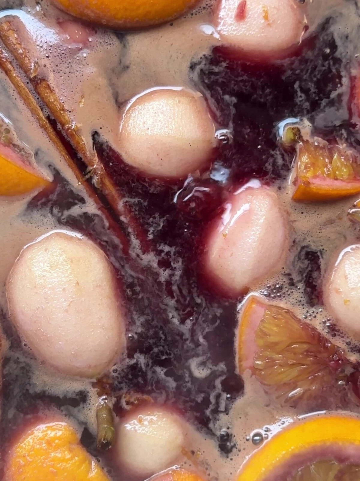 Poached pears in red wine and spice sauce.