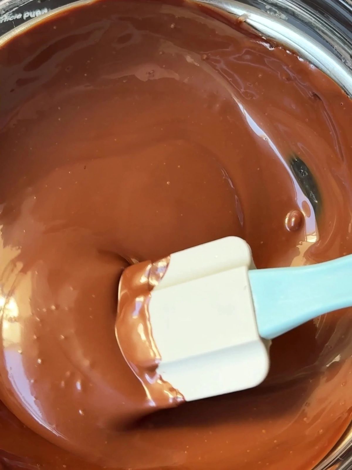 Mixing cream and chocolate.