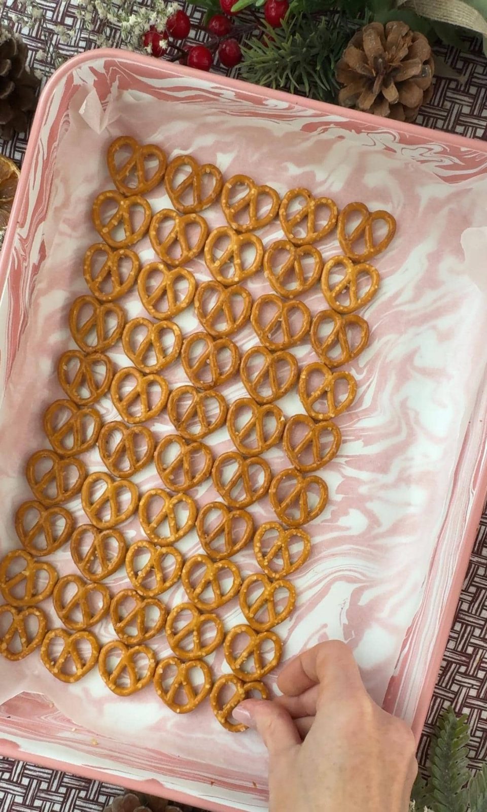 Laying pretzels on the baking tray.