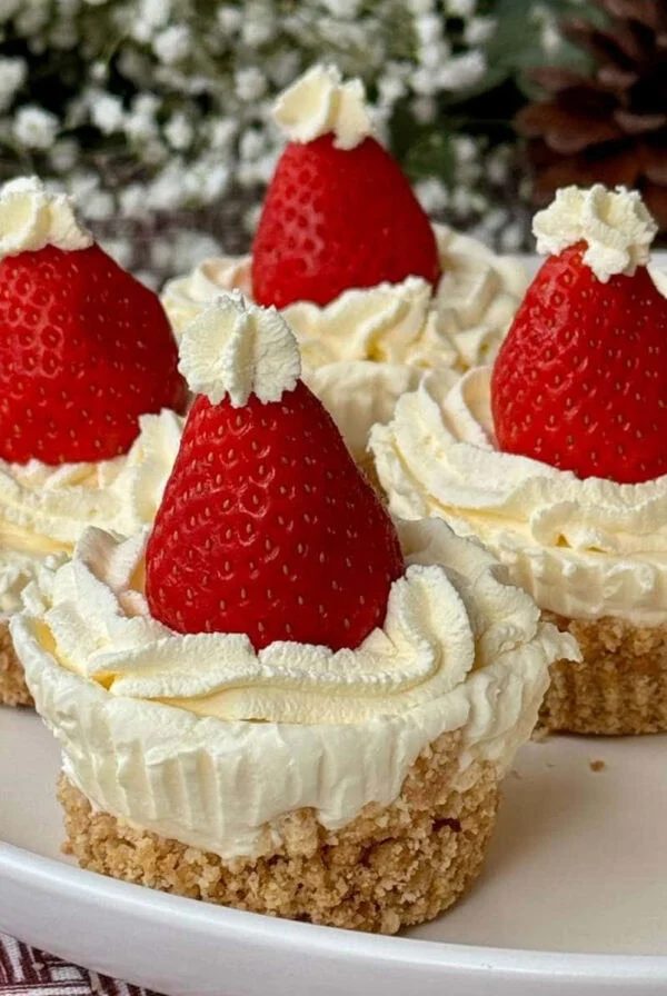 Mini Christmas cheesecakes on plate.