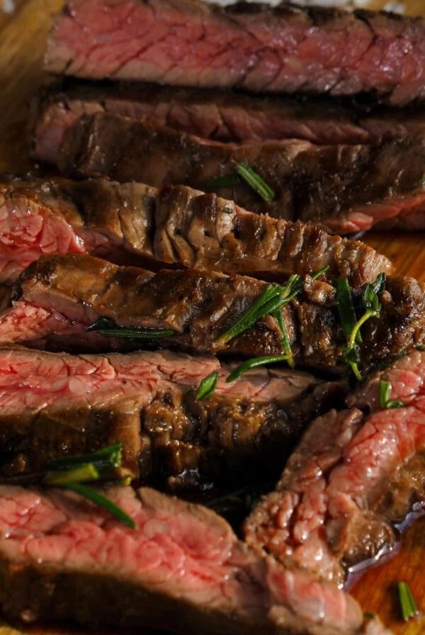rump steak sliced on a wooden board.
