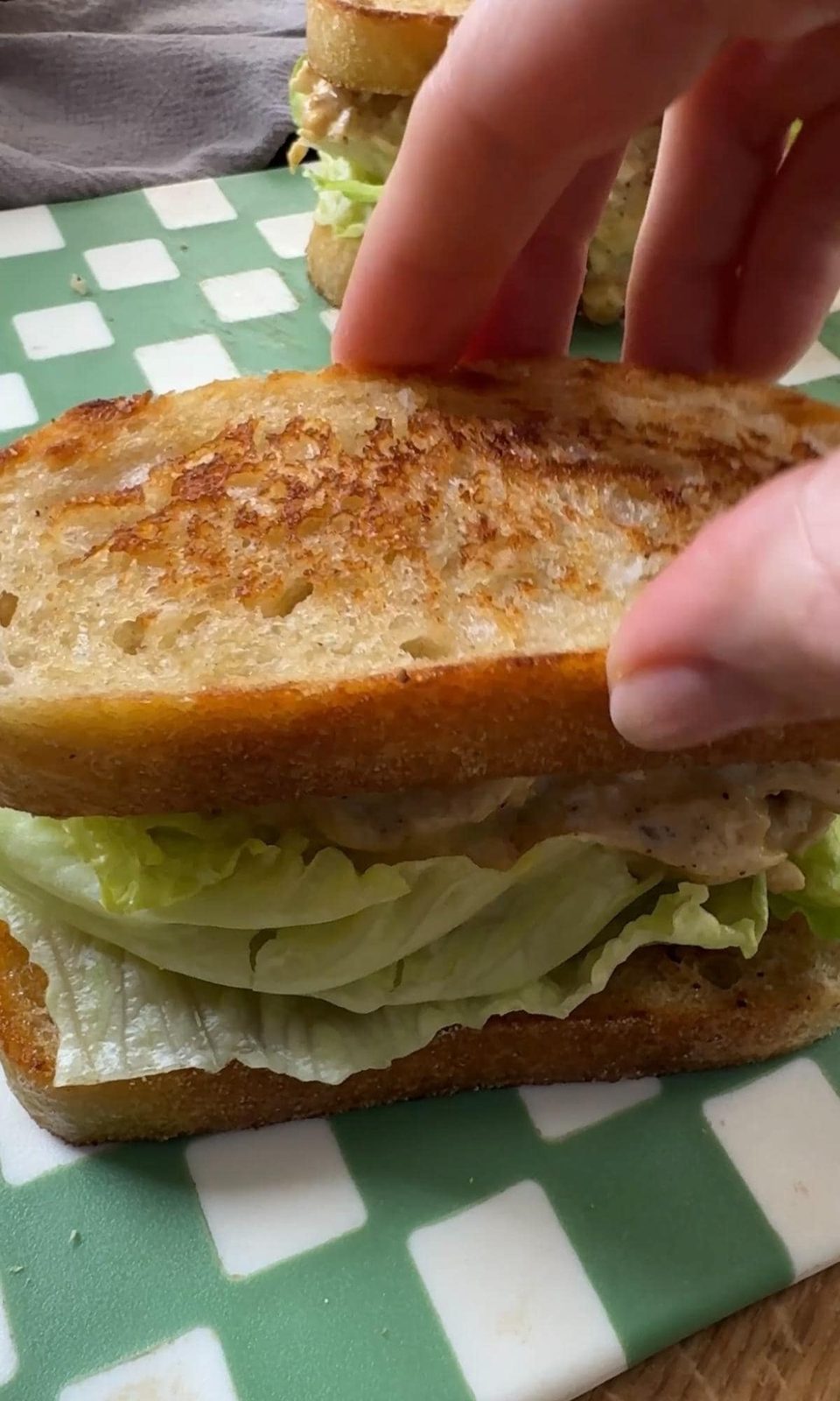 making coronation chicken sandwiches.