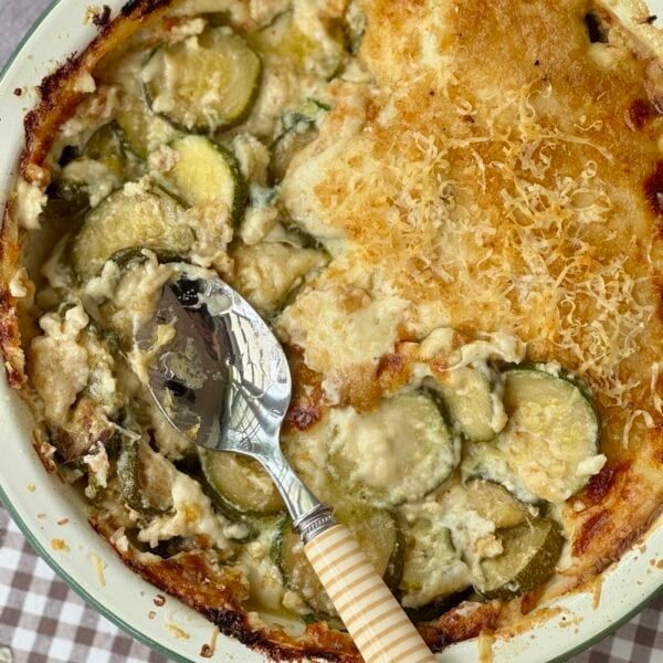 gratin de courgettes in an enamel baking dish.