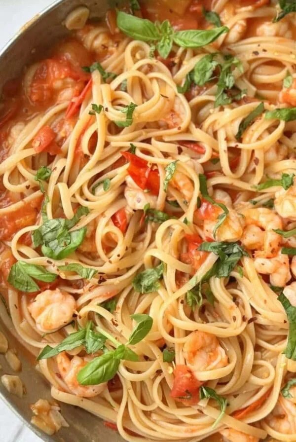 prawn tomato linguine in a silver pan.