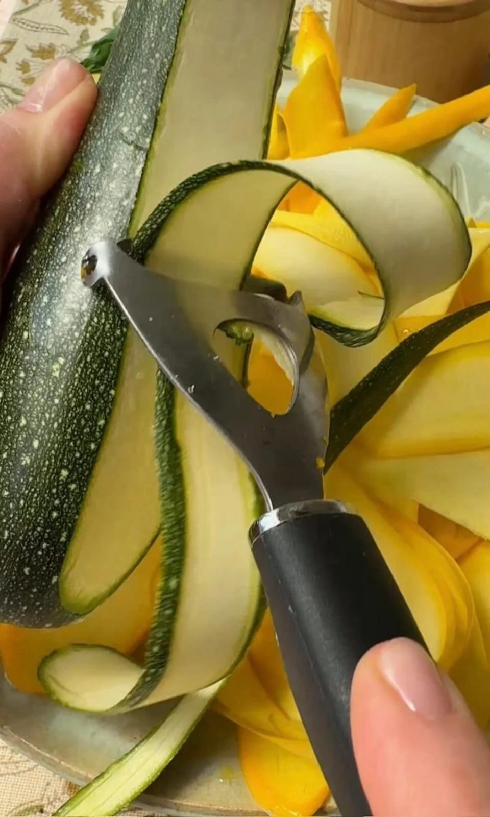 peeling courgettes into ribbon.
