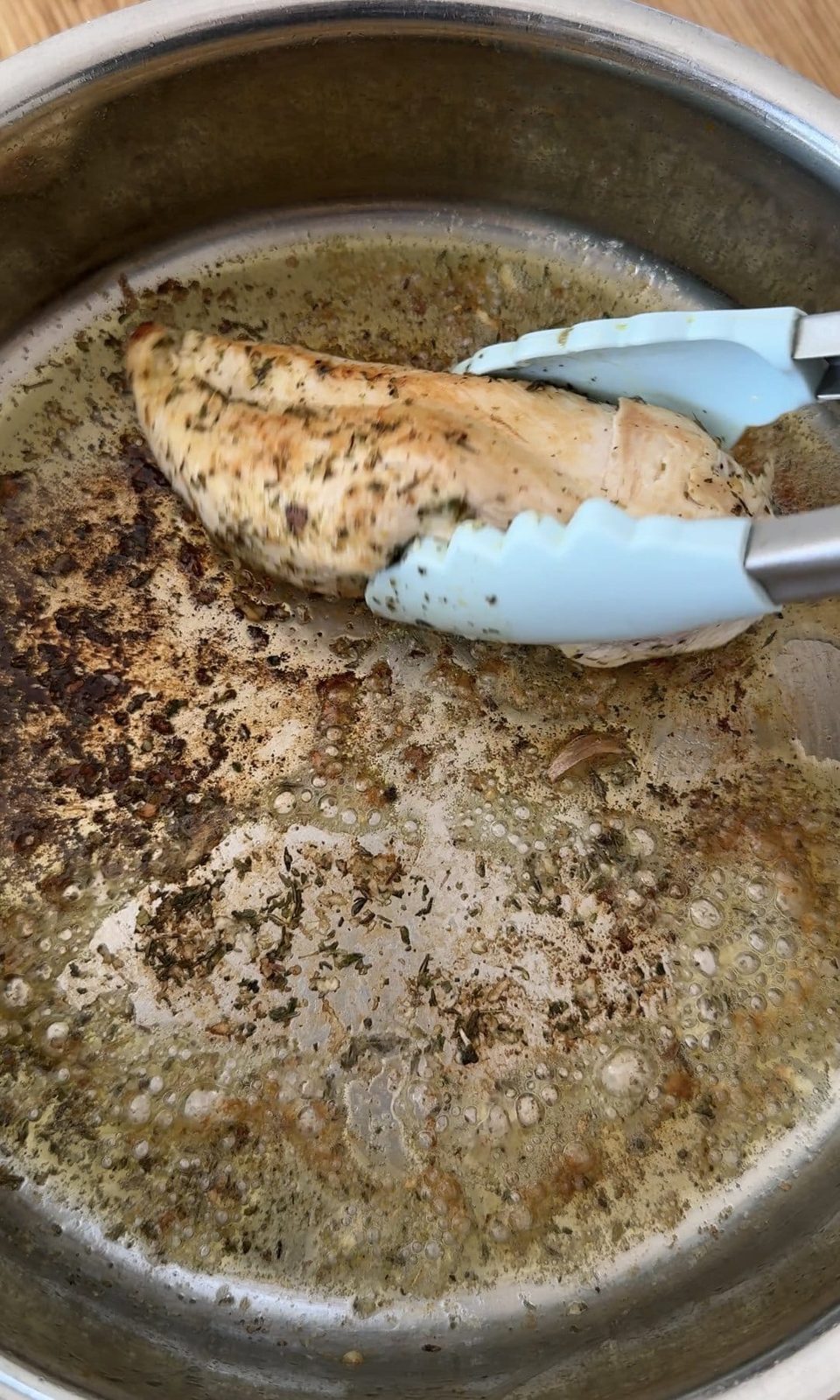 Frying chicken in a pan.