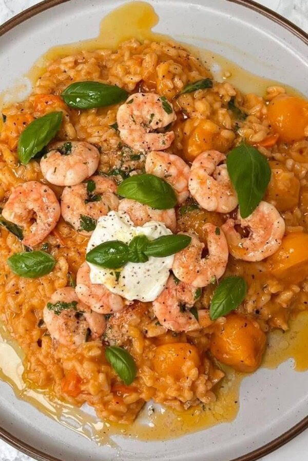 tomato mascarpone risotto on a grey plate.