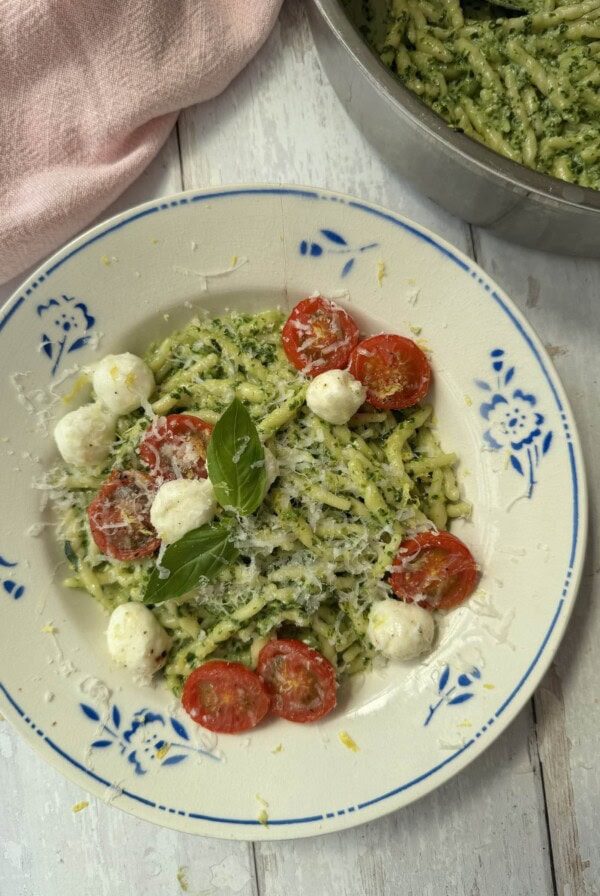 pasta al pesto in a white bowl