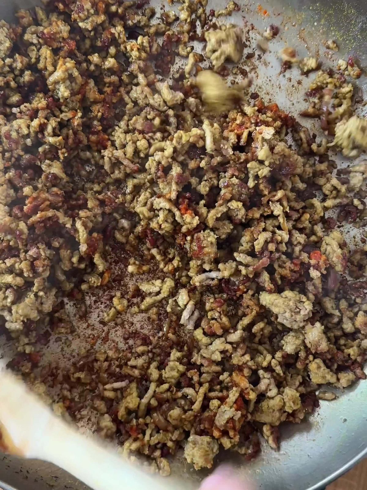 Cooking lamb mince till crispy.