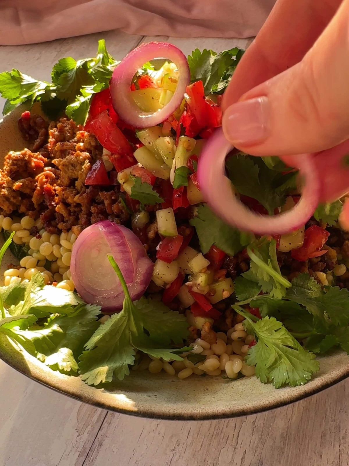 Assembling Mince and Couscous bowl.