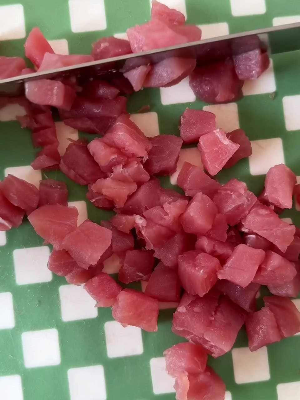 Chopping tuna.