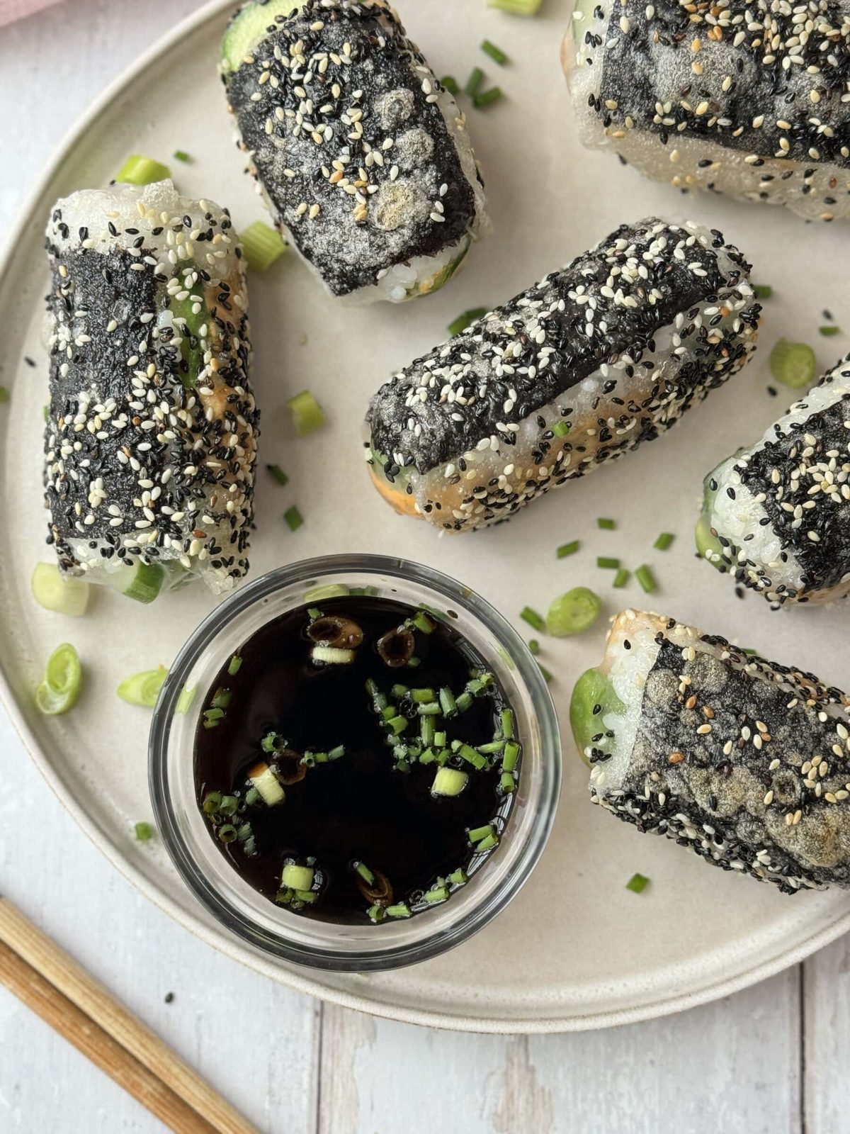 Serving the crispy rice paper rolls with the sauce.