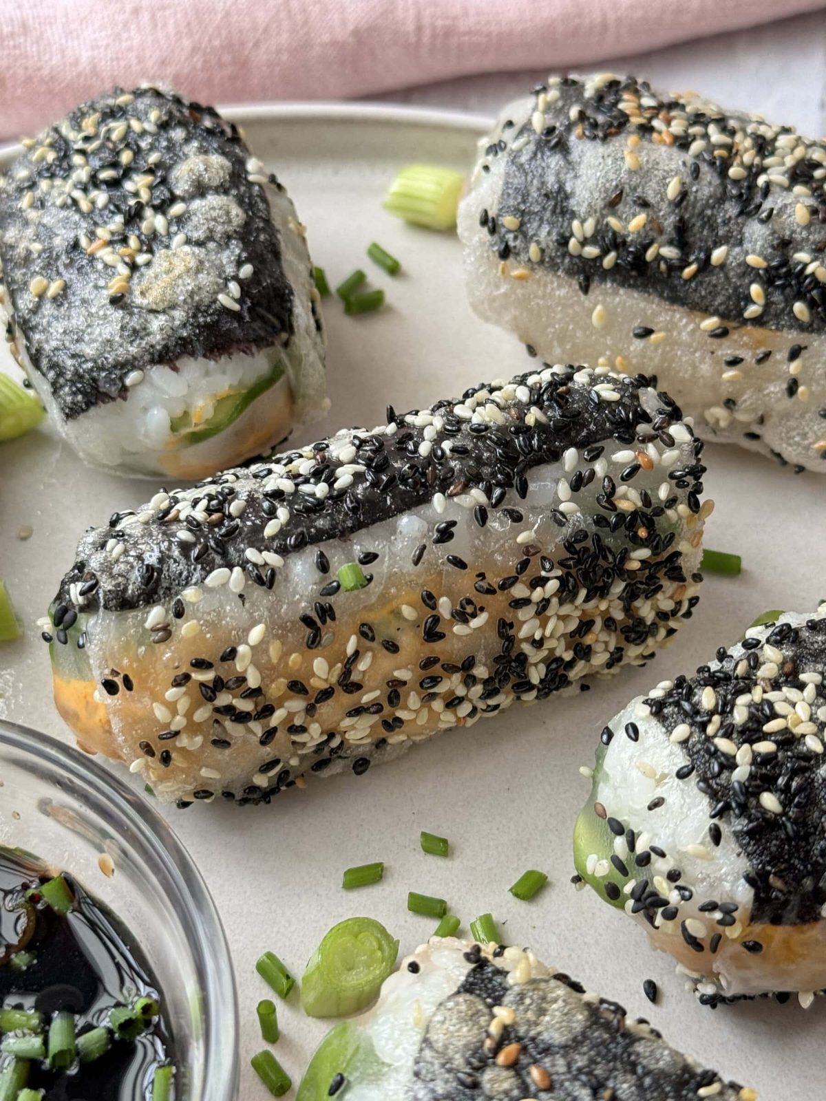 Crispy rice paper rolls on plate.