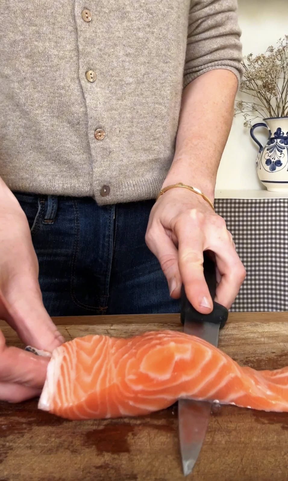 removing skin from salmon.