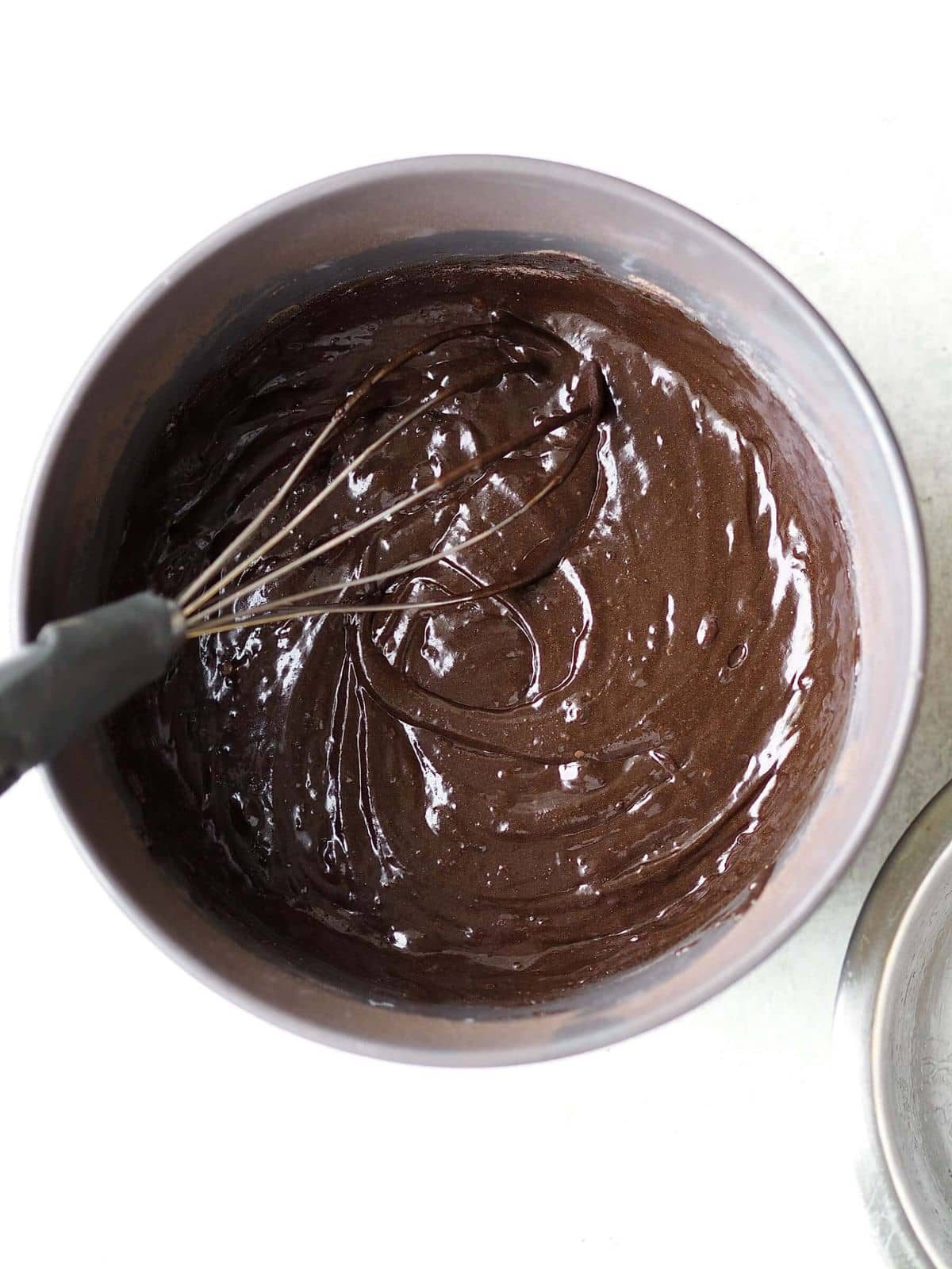 Whisking together chocolate cake mix.