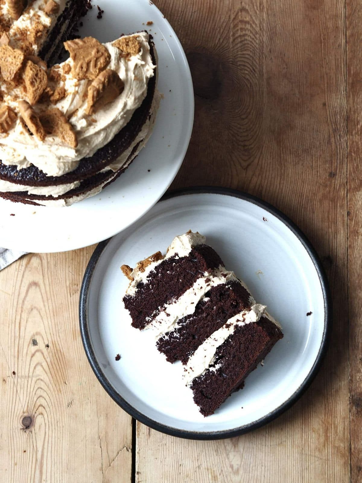 Slice of biscoff cake on plate.