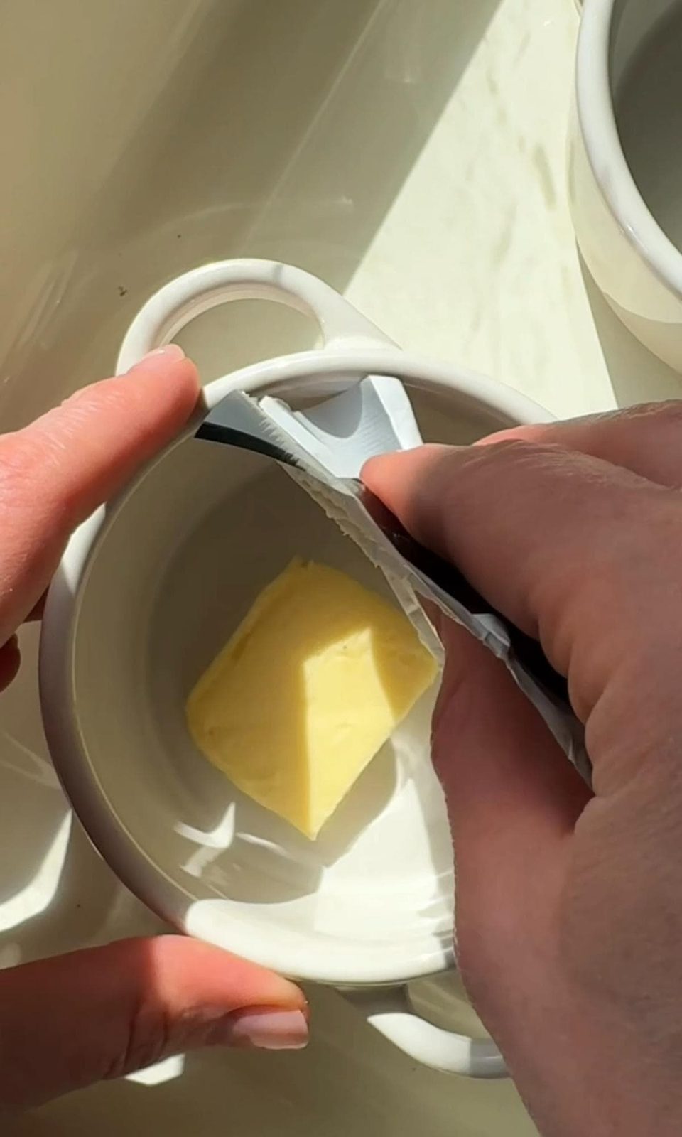 buttering the ramekin.