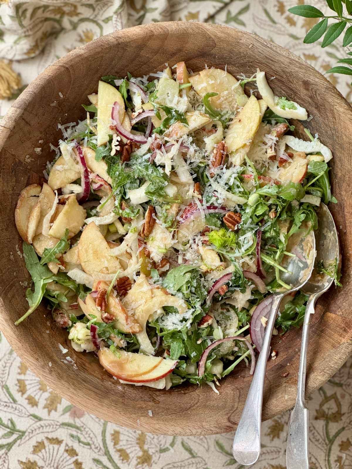 fennel apple salad in a wooden bowl.
