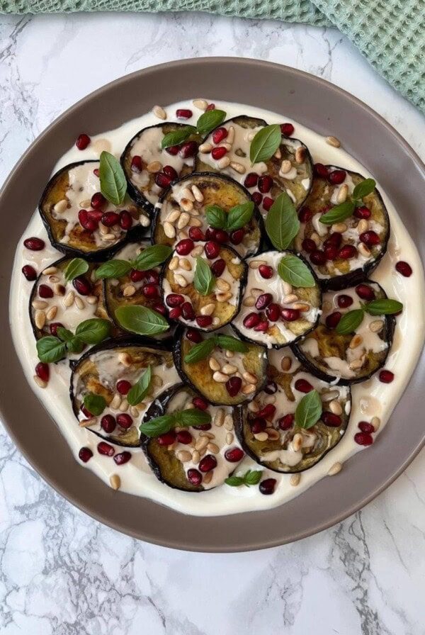 aubergine salad on a grey plate