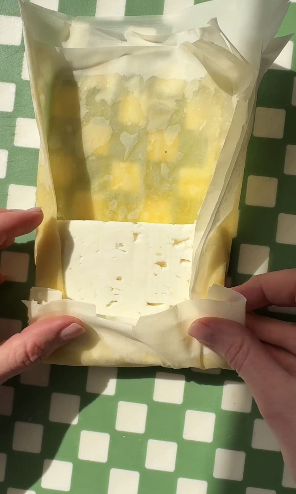 folding filo pastry around feta.