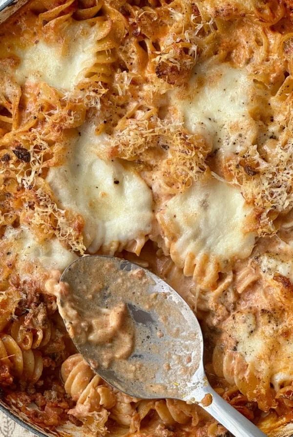 bolognese pasta bake with spoon,