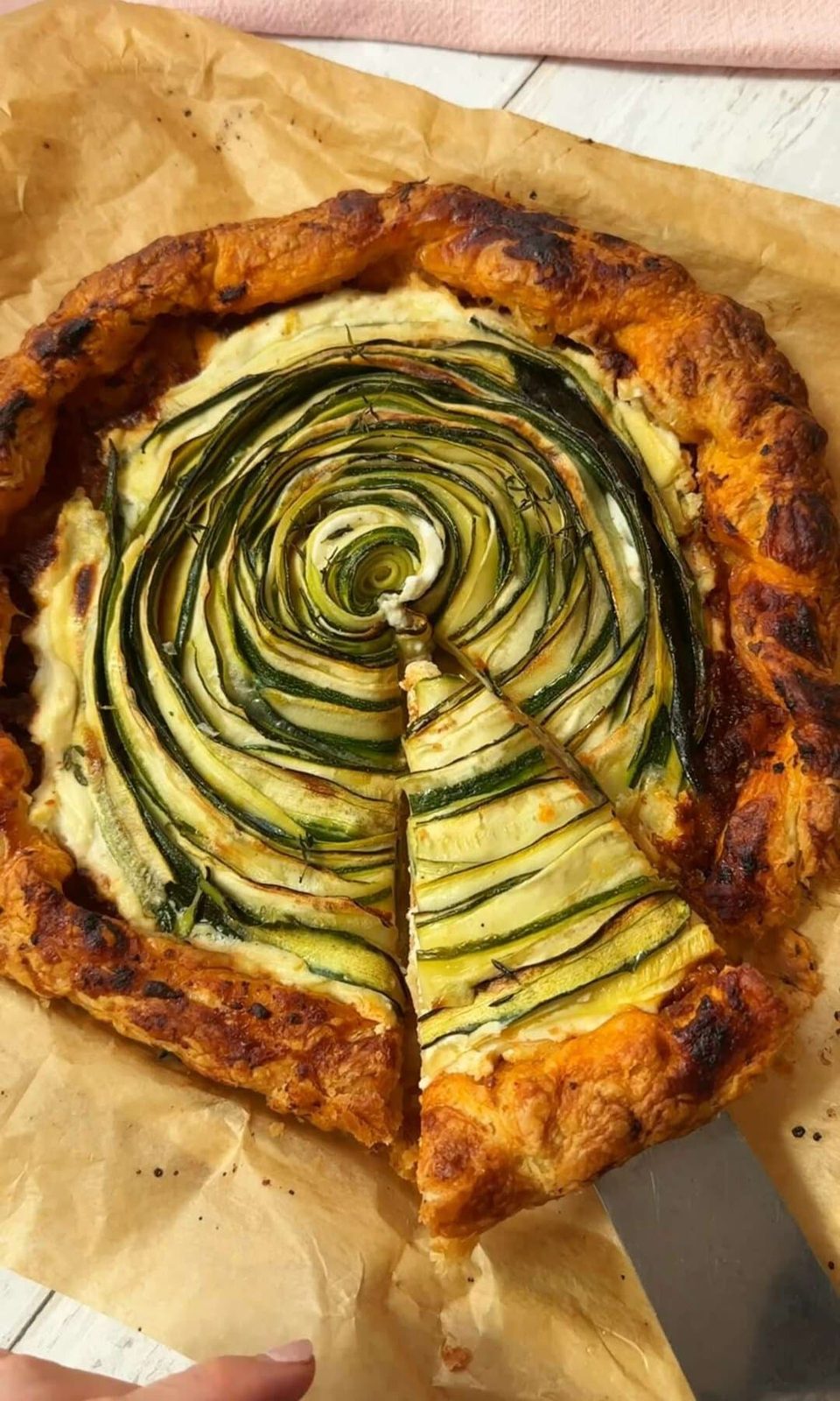 baking and slicing a galette de courgettes.