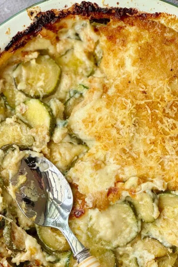 gratin de courgettes in an enamel baking dish.
